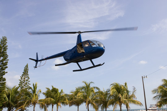Robinson R44 taking off