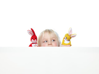 sweet child behind a white wall with red and yellow finger hares