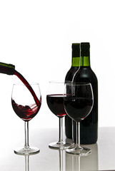 bottles of red wine and wineglasses