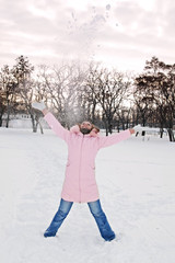 Young beautiful woman with snow