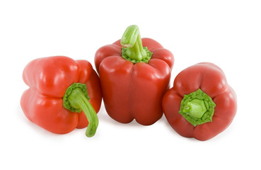 Red sweet peppers over white background