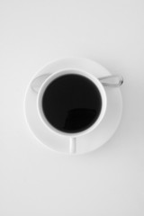 A cup of coffee in black and white.