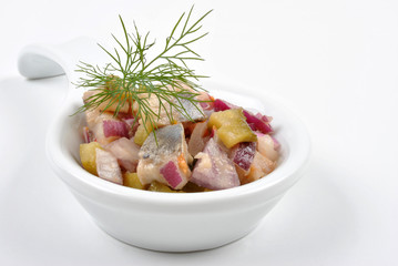 some fresh organic herring salad  in a bowl