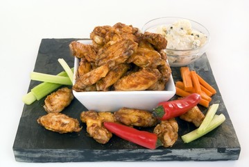 Chicken wings with condiments