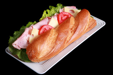 Submarine sandwich on a black background