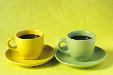 Yellow and green cups of coffee