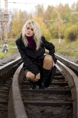 Woman on railway tracks