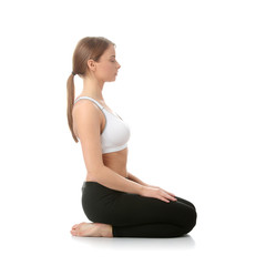 Beautiful young woman doing yoga exercise