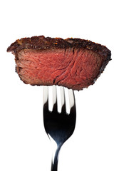 Stück eines gegrilltes Steak auf der Gabel