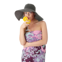 Beautiful woman holding a orange cocktail