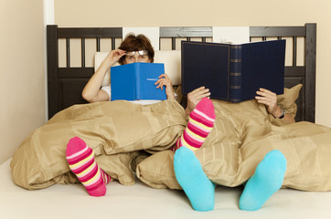 woman reading a book in the bedroom