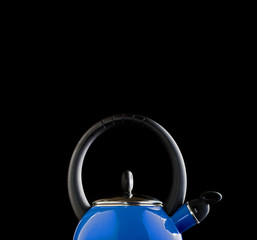 Blue teapot on black background