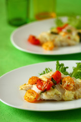 Baked fish fillet  with tomato