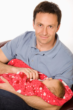 Happy father holds baby