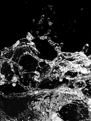 Deurstickers Stylish water splash. Isolated on black background . © Nejron Photo