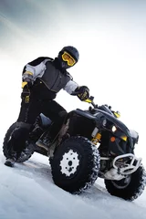 Fototapeten Rider costs near to ATV. Winter season © Beznika