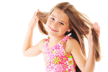 Little blond girl playing with her hair