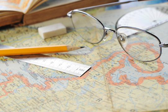 map and  glasses