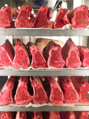Rows of Steak on Metal Racks