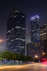 Fotobehang Blue night city lights and buildings in Houston © lunamarina