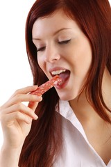 young woman with sausage (isolated)