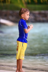boy standing on the beach