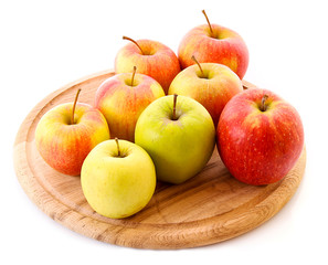 Few apples on wooden tray isolated on white