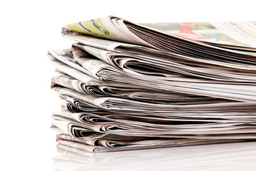 Stacks of old newspapers and magazines