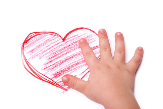 The children's hand is located in heart drawing