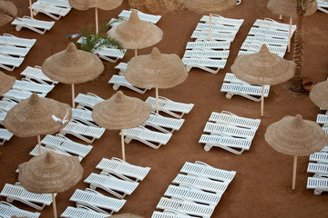 Sunloungers and sunshades on the beac
