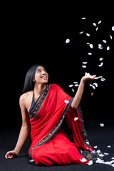 Beautiful Indian girl with rose petals