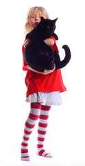 A young girl holding black cat