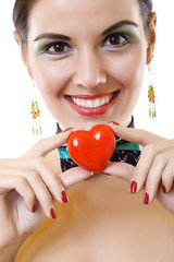 girl holding a small red heart