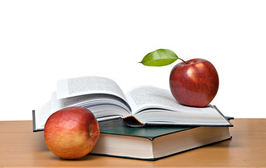 Red apples and open book