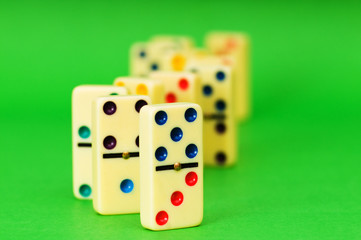 Lots of dominoes on the green background