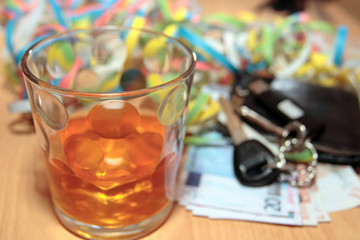 whiskey glass keys and cash