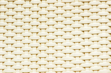 Background made of woven reddish plastic stripes