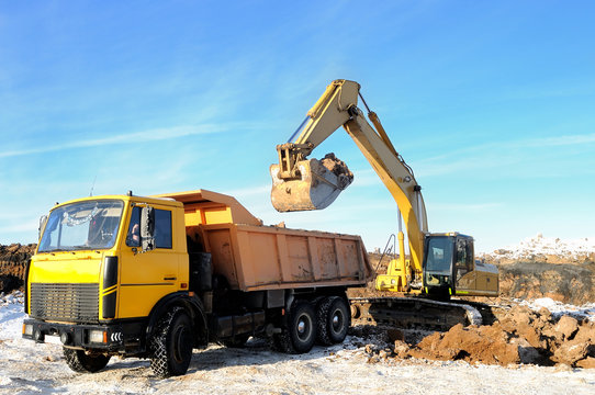 loader excavator and rear-end tipper
