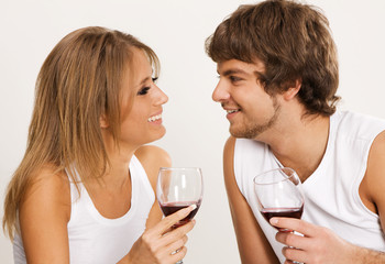Cheerful young couple drinking wine