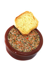 terrine of pate whit herbs on a white background