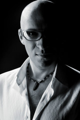 Bald man in a white shirt