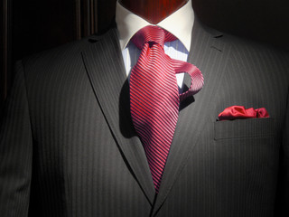 Striped jacket with red striped tie and handkerchief