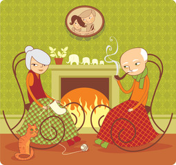 Elderly couple sitting near the fireside