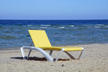 Chaise lounge on beach. sea and sand