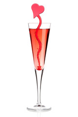 Red champagne alcohol cocktail with heart decoration
