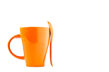 orange cup and spoon