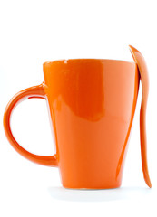 orange cup and spoon