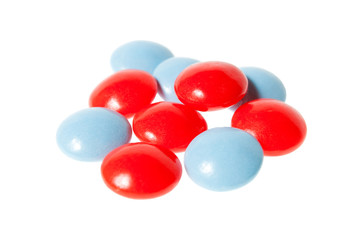 Red and blue pills isolated on white