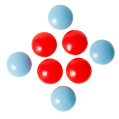 Red and blue pills isolated on white