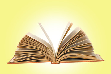 Open book  isolated on yellow background